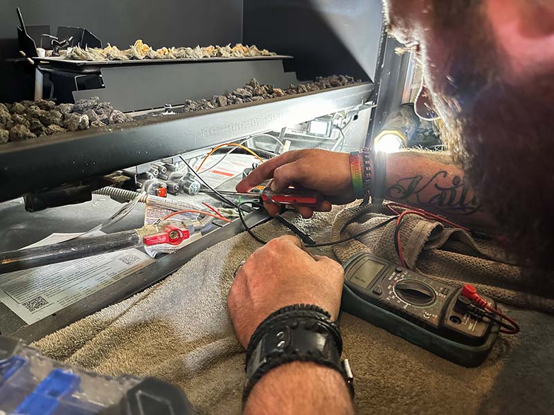 Technician working on gas fireplace